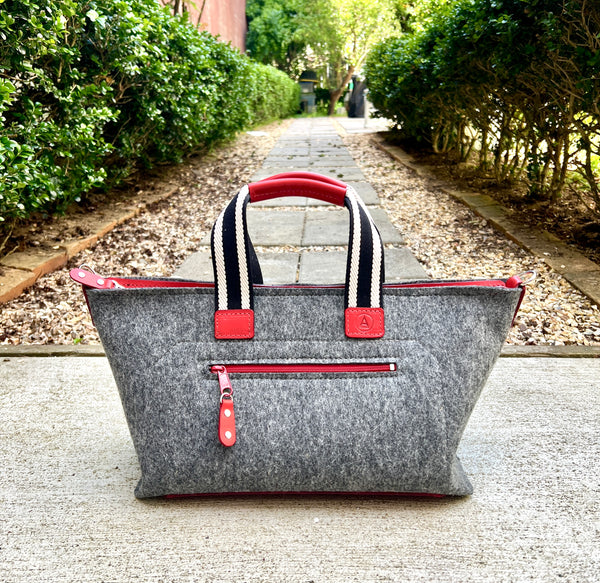 Med gray felt with red leather , stripe handles and red zipper